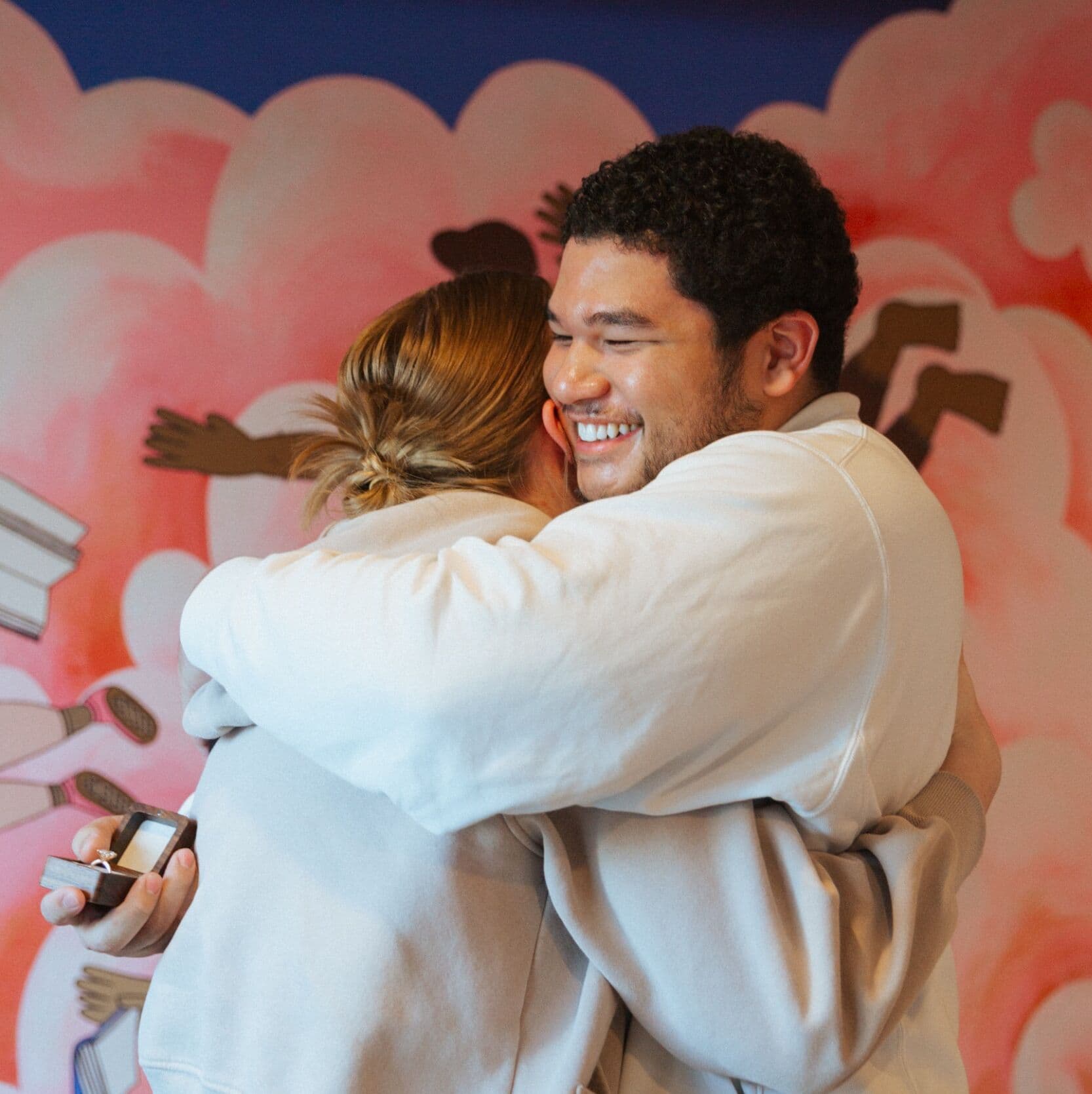 Ashley and Ilan hugging after proposal